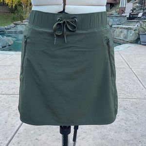 Olive green, athletic skirt with built-in shorts